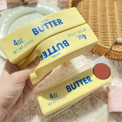YOXIER slow rising butter fidget toy placed on an office desk next to a laptop as a playful stress buster.