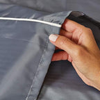 Durable hook and loop fasteners holding the gray pet crate cover securely