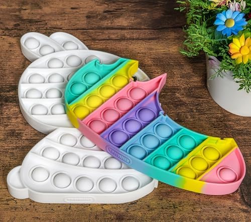 Compact pastel color puzzle toy placed next to a school backpack