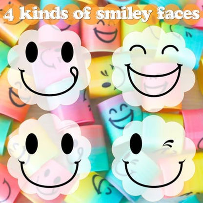 Close-up view of different emoji expressions printed on bright neon rainbow slinky toys