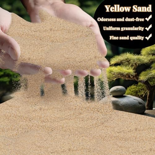 Yellow sand used as a zen garden base with tools