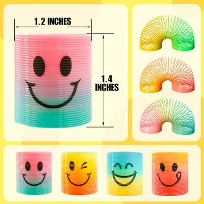 Close up view of the four distinct cheerful smiling face designs on the mini rainbow spring toys.