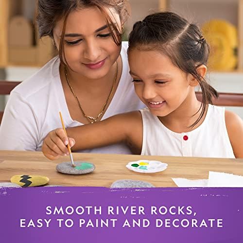 Children decorating smooth river rocks with ten paint colors and googly eyes from the Blue Marble craft set.