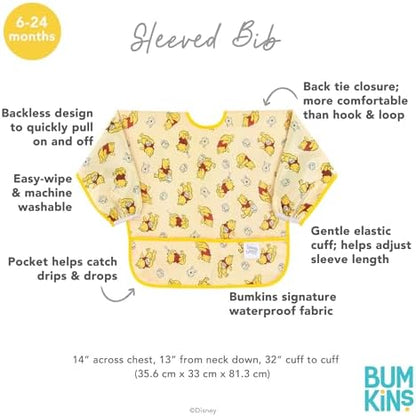 Bumkins Winnie the Pooh sleeved bib displayed flat showing the full single ply fabric design