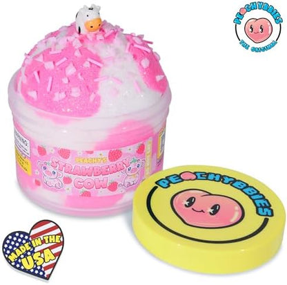 Peachybbies Strawberry Cow Cloud Slime being stretched apart by hands to display its fluffy drizzly texture