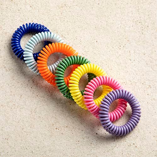 Adult wearing mosquito repellent bracelet while hiking
