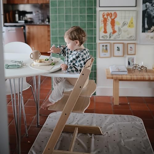Toddler sitting on the grey Fog color floor mat during arts and crafts