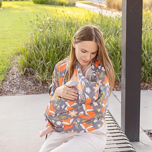 Mom using Pip + Hardy stretchy cover as breastfeeding nursing shawl