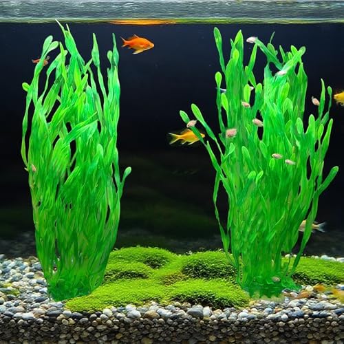 Two pieces of extra tall green artificial aquarium plants standing upright in sand substrate.
