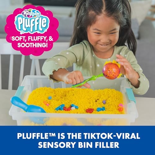 Toddler hands squeezing and mixing vibrant rainbow colors of the mess free sensory bin filler foam
