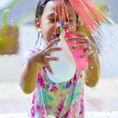 Vibrant orange green and yellow outdoor water bomb toys detached and ready for backyard family games.