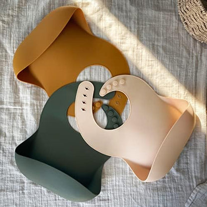 Waterproof silicone feeding bibs showing the wide open deep pocket food catcher