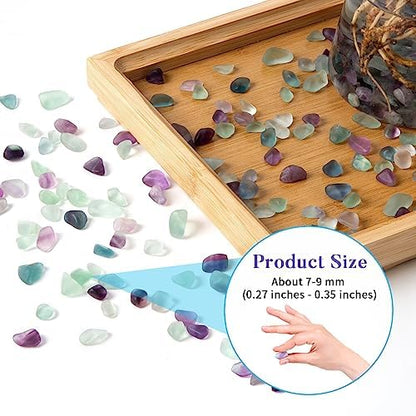 Polished fluorite chips inside a clear glass vase for home decor