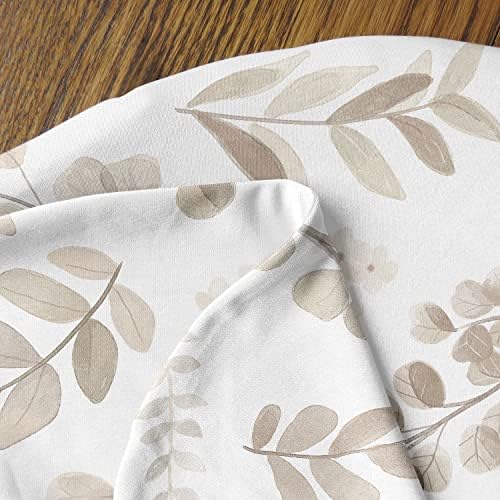 Lifestyle shot of neutral beige and taupe leaf nursery pillow cover