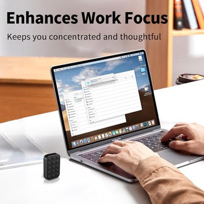 Wshwxy black alloy metal clicker desk gadget sitting next to office stationery on a wooden workspace setup.