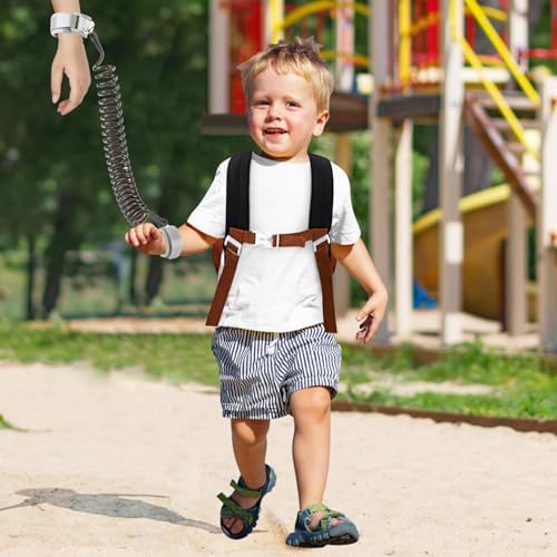 Child using safety leash backpack in outdoor setting