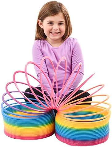 Giant seven inch rainbow plastic slinky toy stretching out for tactile sensory play
