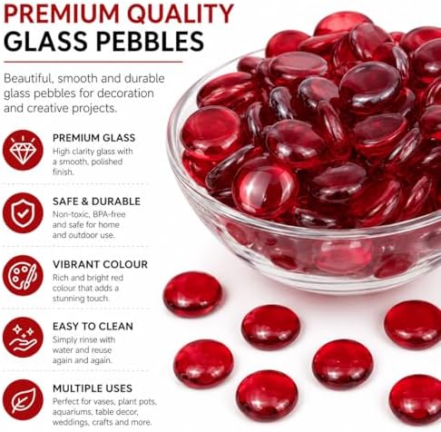 Handful of red glass gems showing size and smooth texture