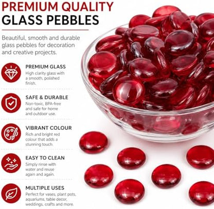 Handful of red glass gems showing size and smooth texture