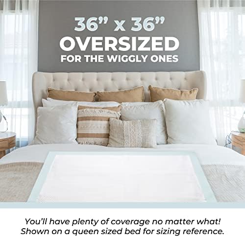 Green Lifestyle chucks pads spread flat on a mattress showing the large thirty-six by thirty-six inch coverage area.