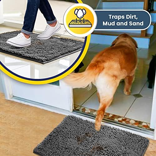 Dog standing on highly absorbent grey pet rug trapping muddy paws
