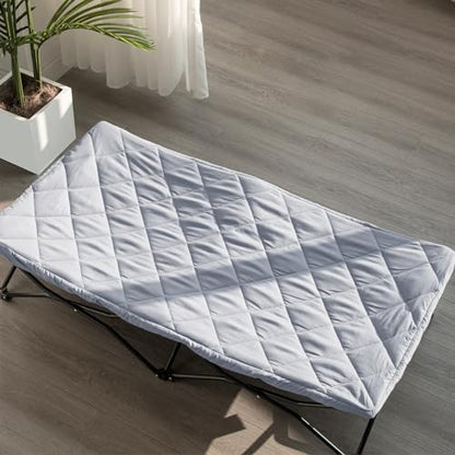 Side angle view of the grey Biloban padded travel bed sheet highlighting its quilted cushioning thickness.