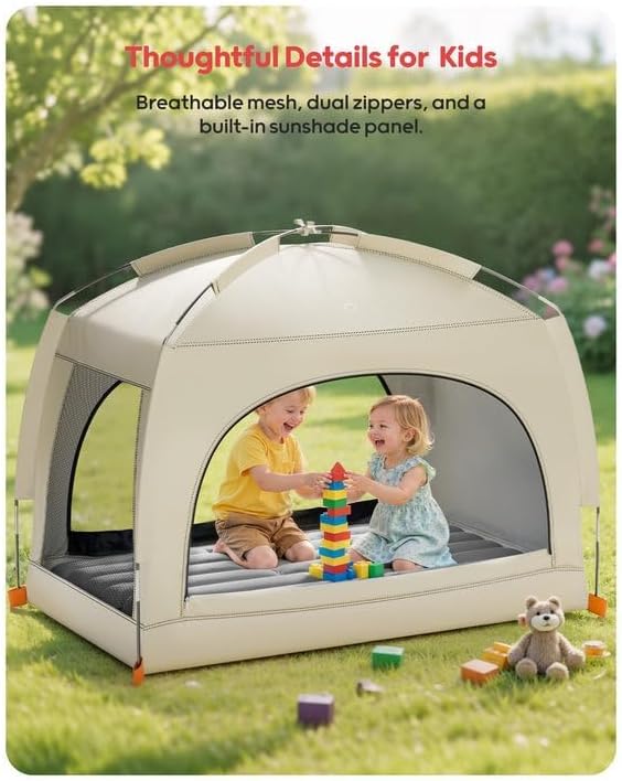 The QPAU toddler travel cot fully assembled outdoors in a garden setting highlighting its insect resistant mesh panels.
