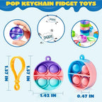 Assorted multicolor mini popping toys with plastic clasps spread out across a table.
