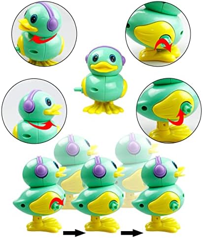 Anditoy mechanical animal toys being wound up by hand to demonstrate battery-free movement.