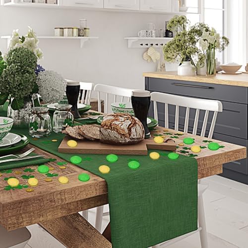Giaueoa gold and green lucky coins arranged next to a holiday centerpiece for creative design inspiration.