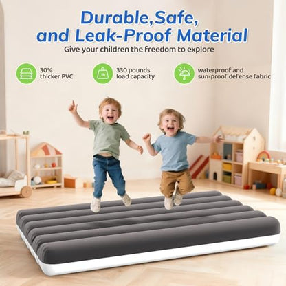 Abdtech toddler travel bed being inflated using the included manual hand pump indoors
