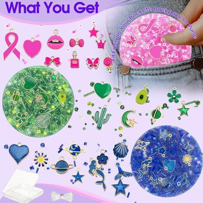 Close up view of the pink Fabrisse skin picking fidget toy demonstrating embedded star and moon charms.