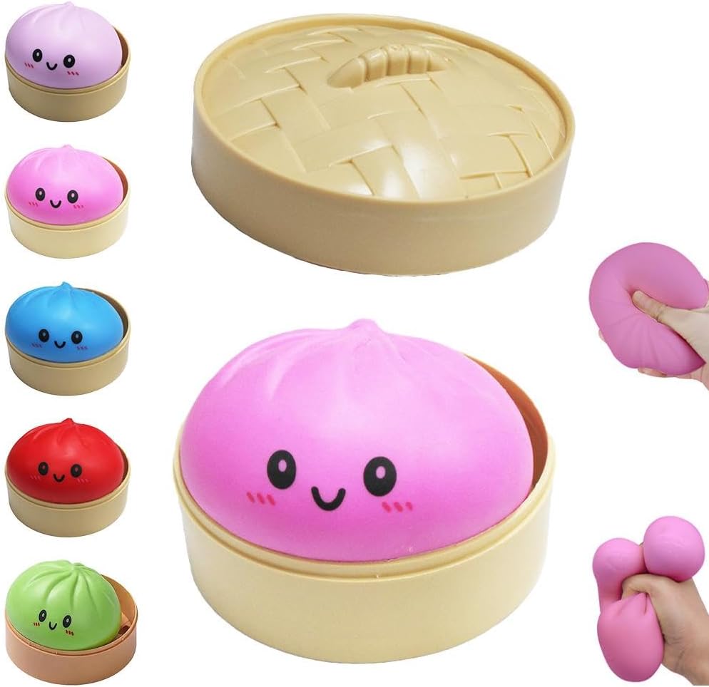 PLGEBR dumpling squishies toy front view showing pink glitter bao bun with a smiling face next to its matching plastic food steamer basket