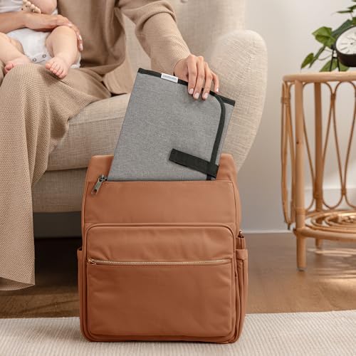 Side profile of Comfy Cubs travel changing mat attached to a bag