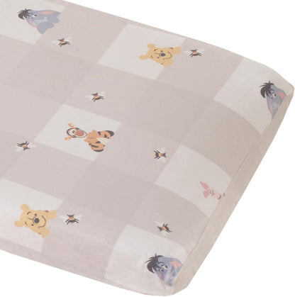 NoJo Disney Winnie the Pooh changing pad cover front view showing grey and white plaid pattern.