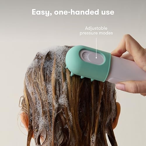 Close up of the Frida Baby soft silicone scrubber attachment designed for gentle newborn skin cleansing.