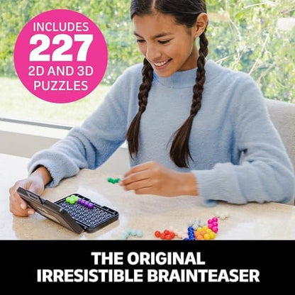 Twelve vibrant plastic puzzle pieces arranged next to the illustrated challenge instruction booklet.