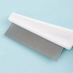 White pet grooming tool with textured non slip plastic handle