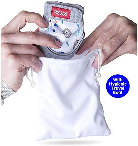 Baby wearing blue penguin Nuby teething mitten