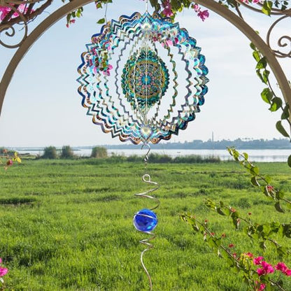 3D kinetic wind spinner hanging in a garden setting