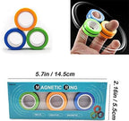 Three metallic magnetic rings spinning on fingers for tactile sensory stimulation.