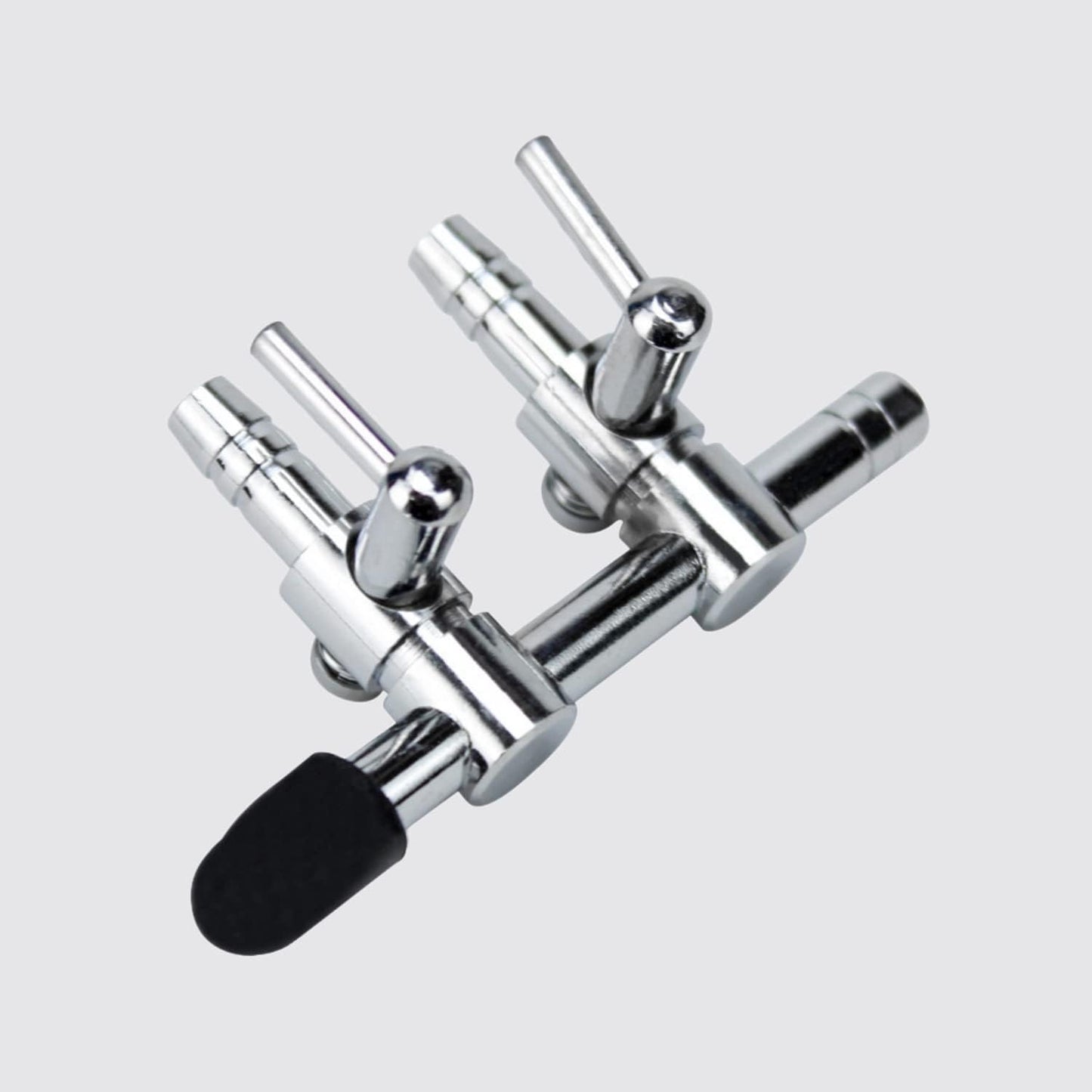 Close-up of the adjustable chrome copper levers on the aquarium air flow control manifold.