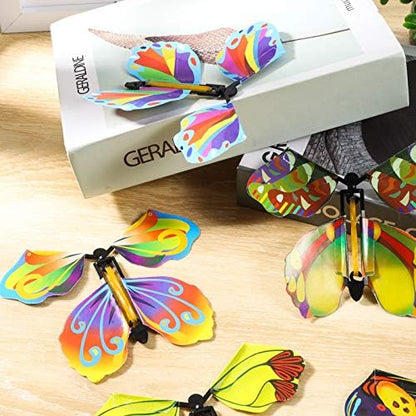 AhlsenL mechanical butterfly toy flattened inside an invitation card book marker layout