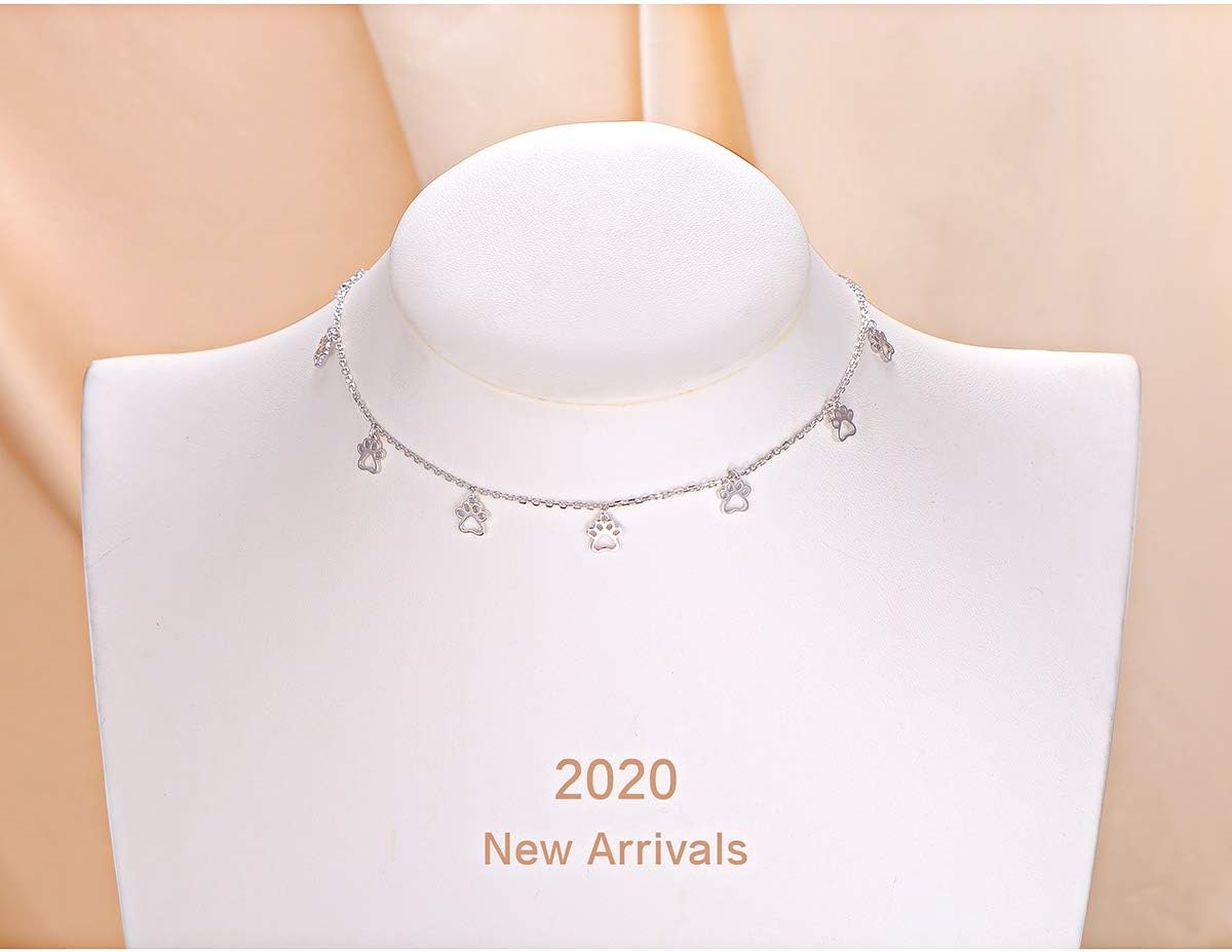 Detailed shot of the high-polish rhodium plated rolo chain showcasing the 1.5 mm width and cubic zirconia stones.