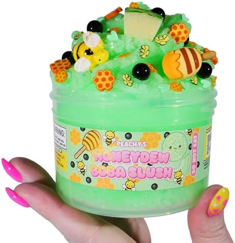 Vibrant green scented icee slime being squeezed to show dense and sizzly texture.
