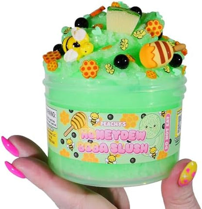 Vibrant green scented icee slime being squeezed to show dense and sizzly texture.