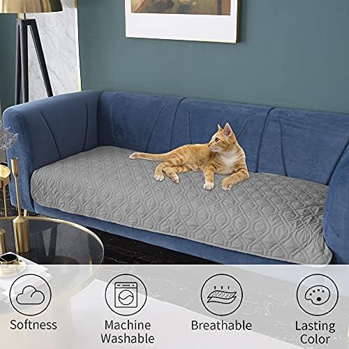 Durable machine washable dog mat laying on a contemporary dark grey couch