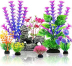 Multi-sized plastic aquarium decorations showing weighted pedestals for underwater stability.