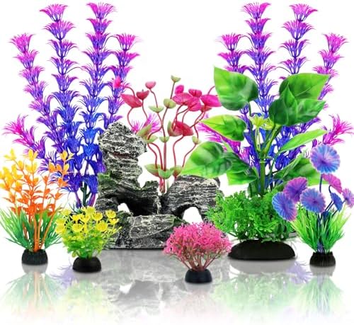 Multi-sized plastic aquarium decorations showing weighted pedestals for underwater stability.