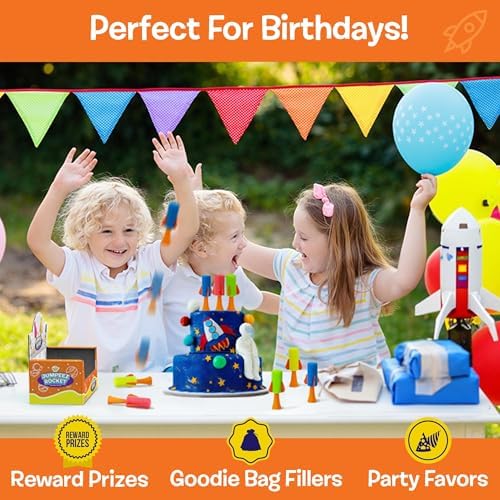 Full set of twenty-four assorted color jumping rubber popper toys arranged neatly for party favors.